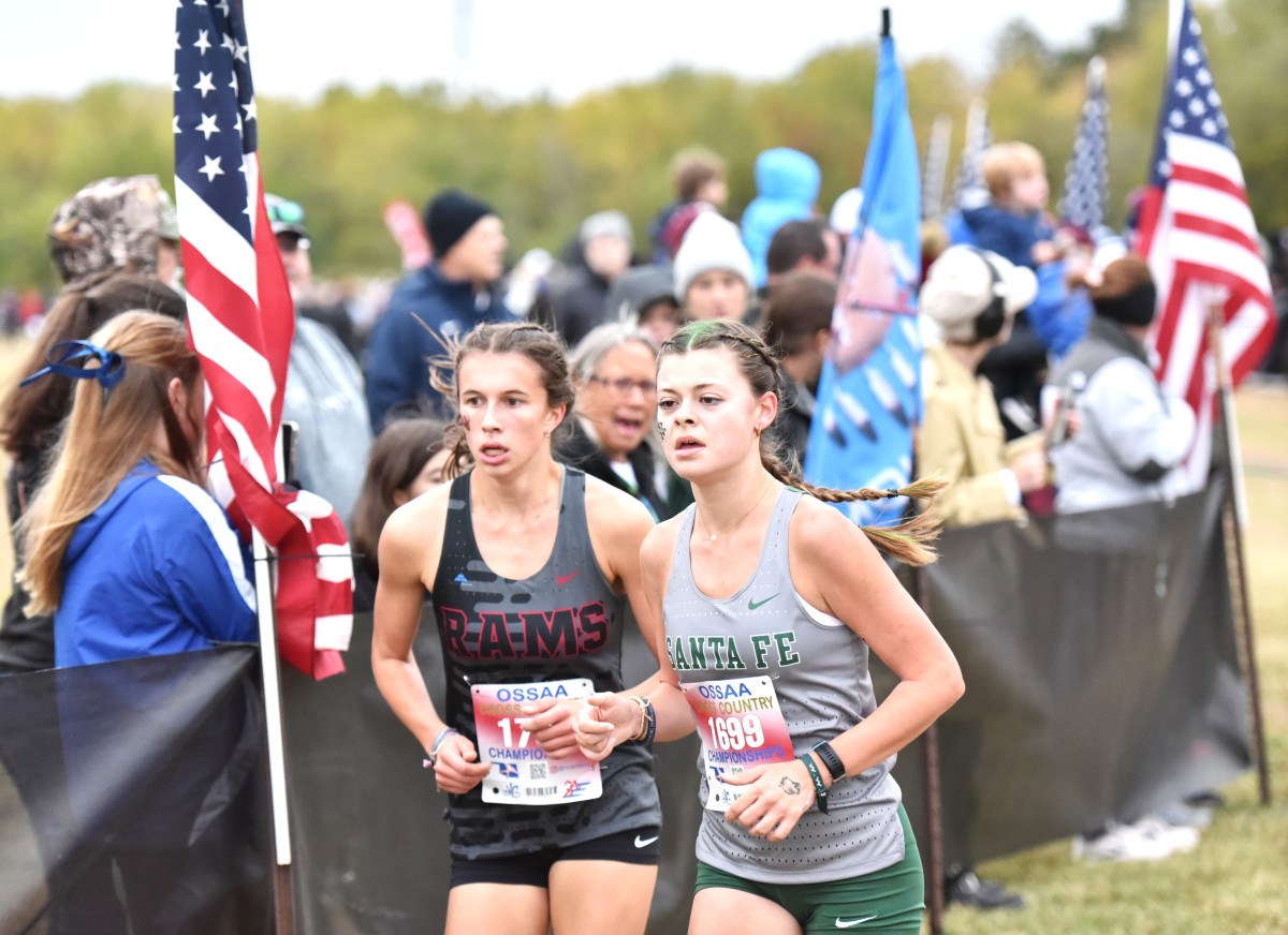Owasso's Bella Nelson (left) and Edmond Santa Fe's Natalie Duggan compete during the Class 6A girls cross country state meet Oct. 28, 2023.